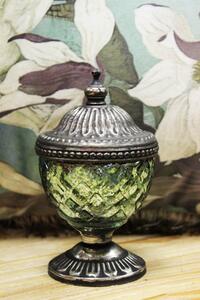 Zöld rusztikus gyertya egy üvegben, kupolával