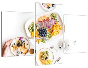 Tányérok gyümölcsökkel az asztalon képe (90x60 cm)