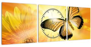 Kép - Sárga pillangó virággal (órával) ()