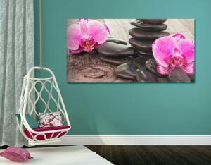 Kép orchidea és zen kövek fa háttéren