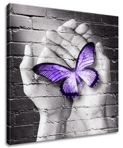 Gario Vászonkép Lila pillangó tenyéren Méret: 40 x 60 cm