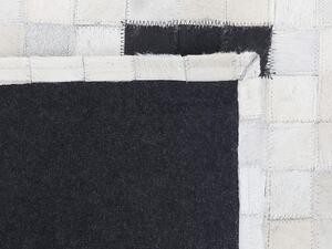 Fekete és fehér bőrszőnyeg 160 x 230 cm BOLU