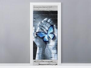 Gario Fotótapéta ajtóra Kék lepke a tenyereken Anyag: Öntapadó, Méret: 95 x 205 cm
