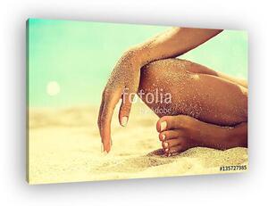 Woman In Relaxation On Tropical Beach with sand , body parts . T (vászonkép)