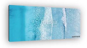 Wave on the beach as a background. Beautiful natural background at the summer time (vászonkép)