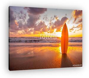Surfboard on the beach in sea shore at sunset time with beautiful light (vászonkép)