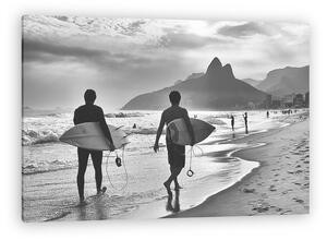 Scenic black and white view of Rio de Janeiro, Brazil with Brazilian surfers walking along the shore of Ipanema Beach (vászonkép)