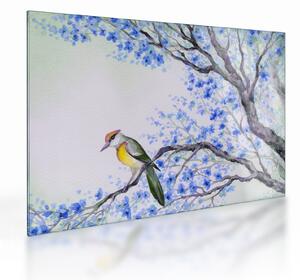 Kép - Madár egy fán kék virágokkal (üvegen) (70x50 cm)