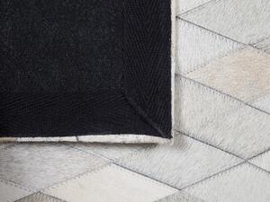 Fekete és fehér bőrszőnyeg 140 x 200 cm MALDAN