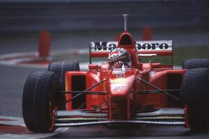 Fotográfia Michael Schumacher in a Ferrari F310B at the Belgian GP, Spa Francorchamps, Belgium, 1997, (40 x 26.7 cm)
