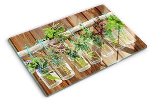 Üveg vágódeszka Gyógynövények üvegekben, fából készült háttéren