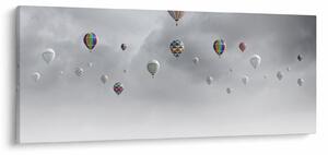 Kép - léggömbök egy téglafal felett (120x50 cm)