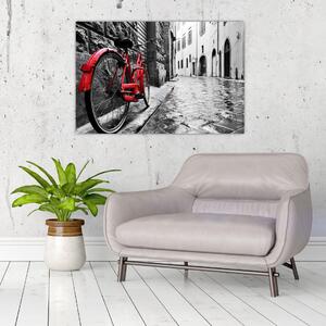 Egy vörös kerék képe egy macskaköves utcán (90x60 cm)