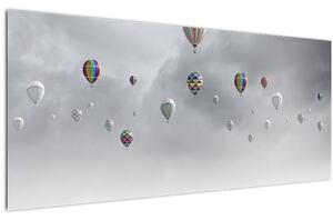 Kép - léggömbök egy téglafal felett (120x50 cm)