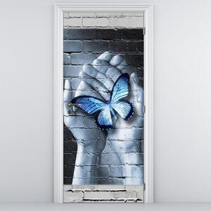 Fotótapéta ajtóra - Kék pillangó a tenyérben (95x205cm)