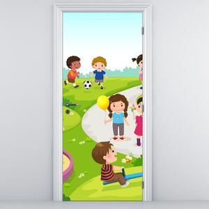 Fotótapéta ajtóra - Gyermekek szórakozása a homokozón (95x205cm)