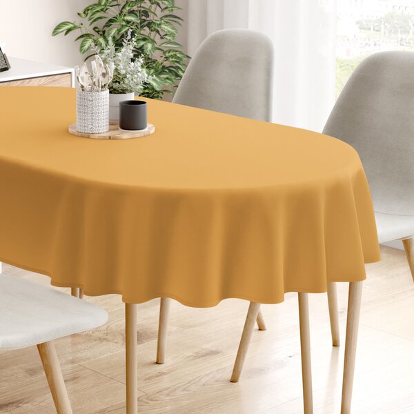 Goldea pamut asztalterítő - mustárszínű - ovális 120 x 160 cm
