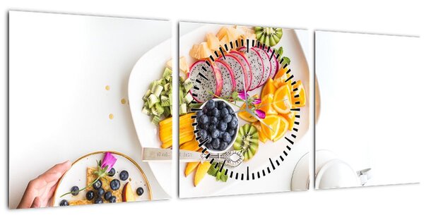 Tányérok gyümölcsökkel az asztalon képe (órával) (90x30 cm)
