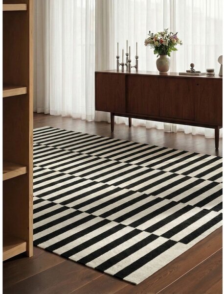 Fekete-fehér kétoldalas kézi szövésű gyapjú szőnyeg 200x300 cm Donna – Hanse Home