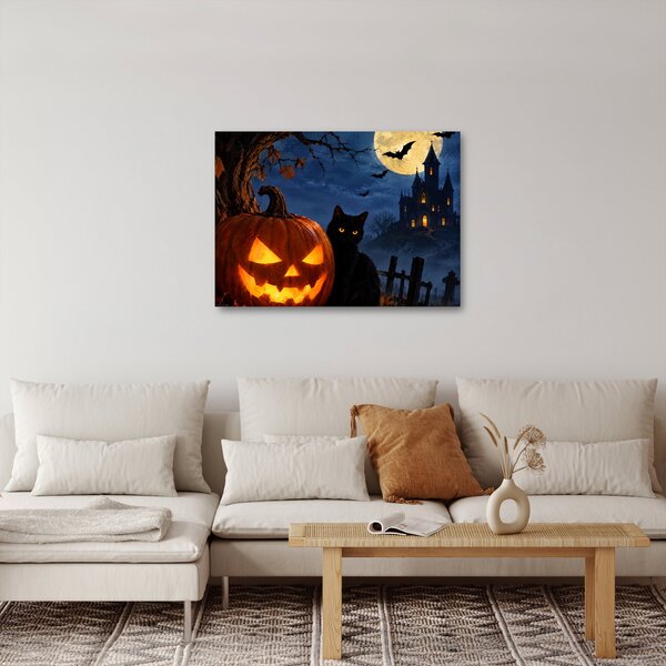 Kép - Fekete macska egy világító halloweeni tök mellett (70x50 cm)