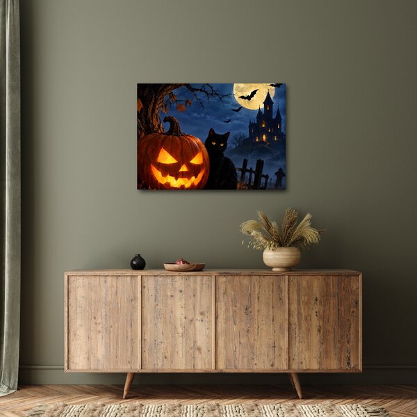 Kép - Fekete macska egy világító halloweeni tök mellett (70x50 cm)