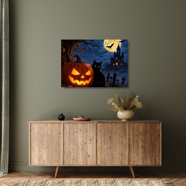 Üveg kép - Fekete macska egy világító halloweeni tök mellett (70x50 cm)