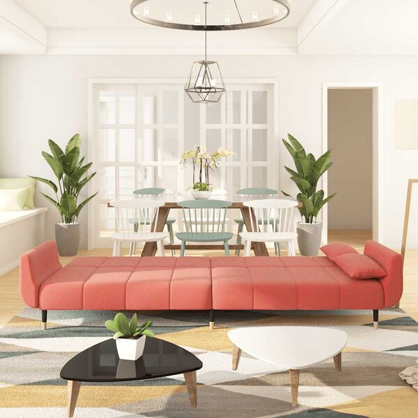 Kétszemélyes rózsaszín bársony kanapéágy két párnával