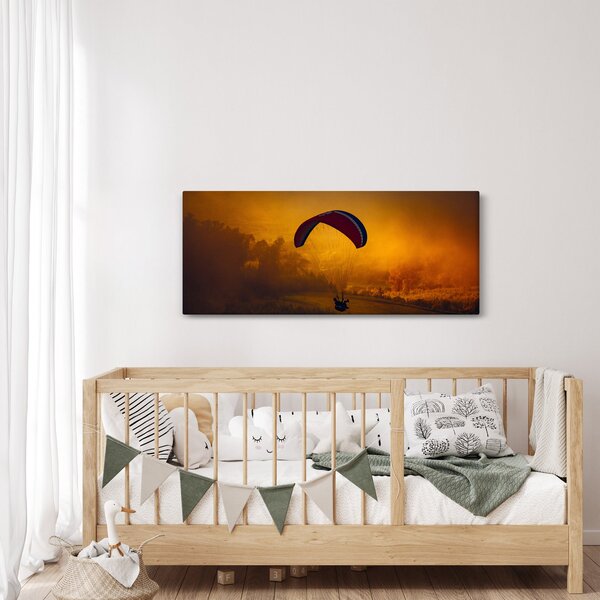 Ejtőernyős a naplementében képe (120x50 cm)