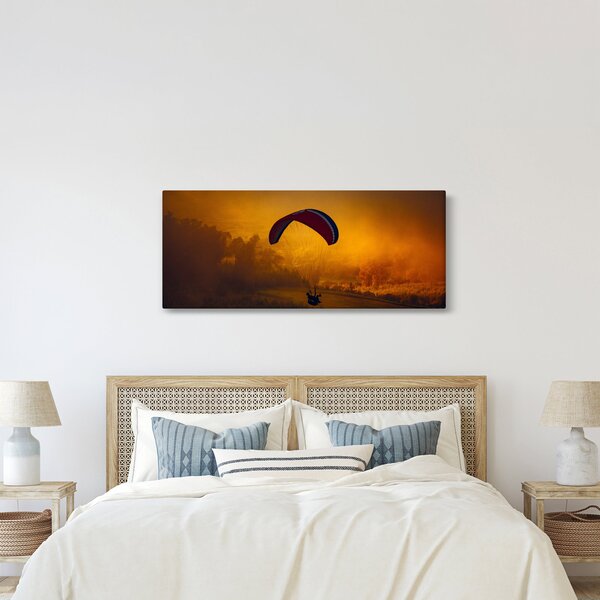 Ejtőernyős a naplementében képe (120x50 cm)