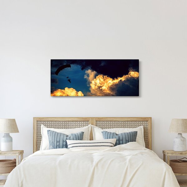 Ejtőernyős a felhőkben képe (120x50 cm)