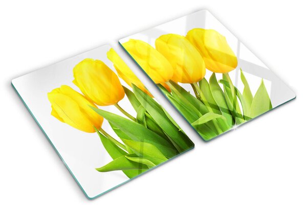 Üveg vágódeszka fényképpel Sárga tulipánok zöld háttér előtt