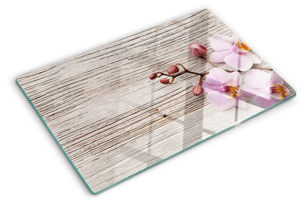 Üveg vágódeszka fényképpel Orchideák fa háttéren