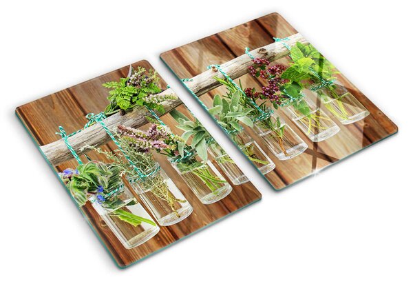 Üveg vágódeszka Gyógynövények üvegekben, fából készült háttéren