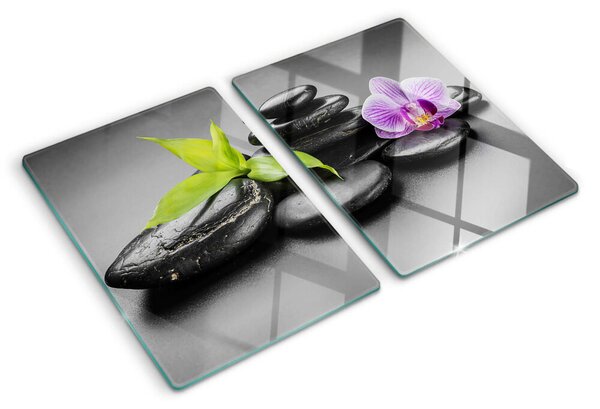Üveg vágódeszka Kövek és orchidea a háttérben