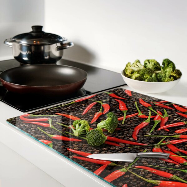 Üveg vágódeszka fényképpel Chili paprika fekete borssal