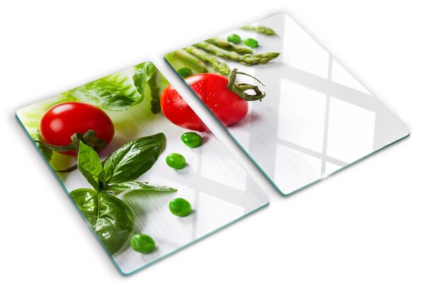 Üveg vágódeszka fényképpel Zöldségek egy fehér konyhapulton