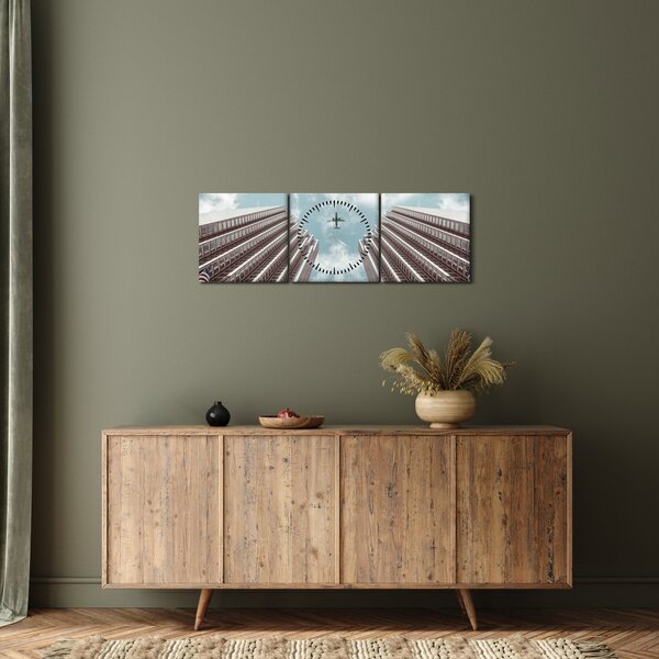 Repülőgép az épületek között képe (órával) (90x30 cm)