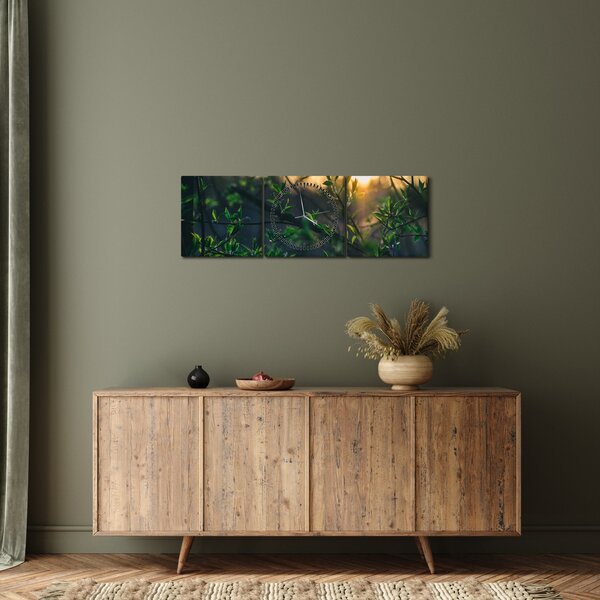 A ragyogó nap képe a fák gallyain keresztül (órával) (90x30 cm)