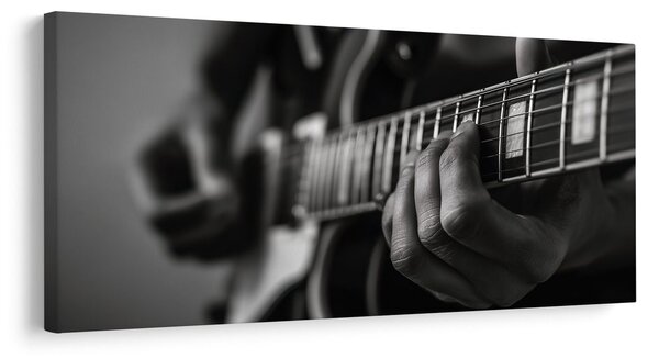 Kép ujjak a gitárhúrokon
