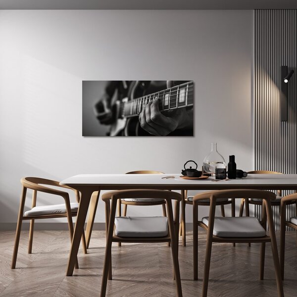 Kép ujjak a gitárhúrokon