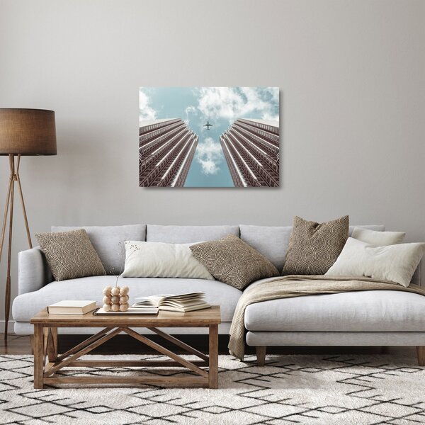 Repülőgép az épületek között képe (üvegen) (70x50 cm)