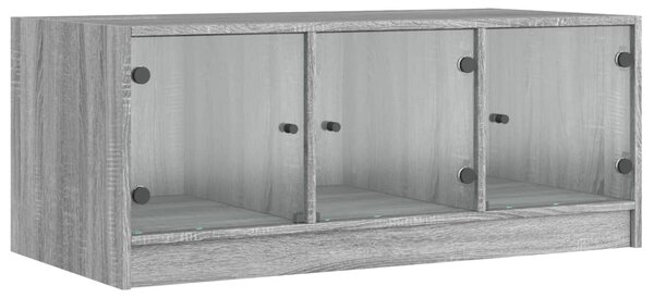 Szürke sonoma színű dohányzóasztal üvegajtókkal 102x50x42 cm