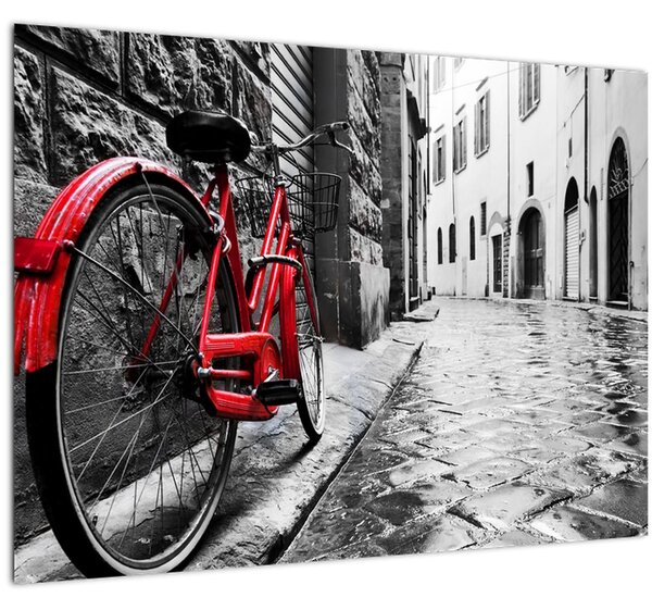 Egy vörös kerék képe egy macskaköves utcán (70x50 cm)
