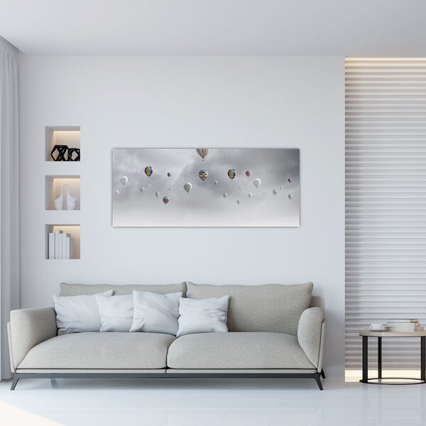 Kép - léggömbök egy téglafal felett (120x50 cm)
